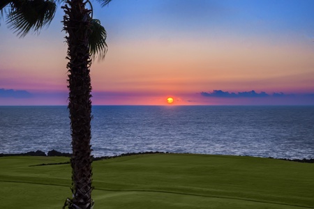 Unwind at sunset with sweeping ocean views just moments from Kona Blue Vacations Holua Kai.