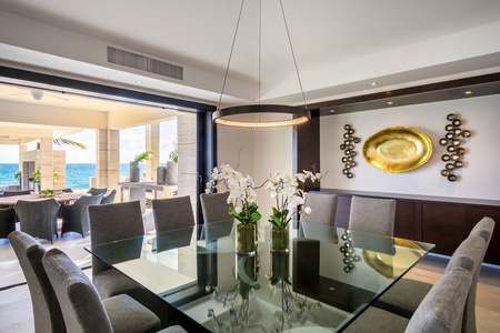Dine in style in the elegant dining area with ocean views through sliding doors.