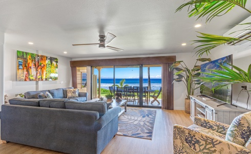 Relax in the open living area looking to the lanai with stunning ocean views.