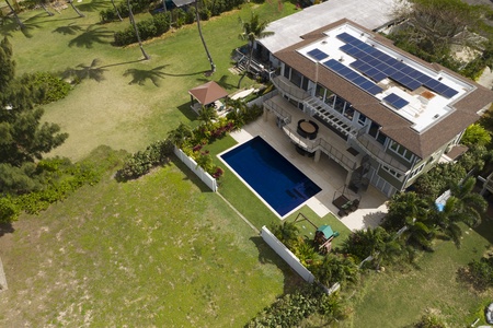 Beautiful home with pool and back yard leading to the ocean.