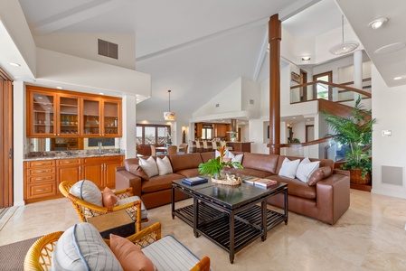 Soaring ceilings, warm wood accents, and coastal light create a calm, inviting retreat.