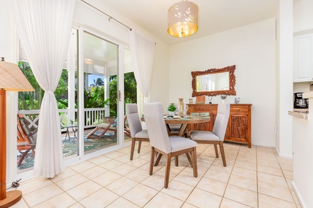 Stylish dining area connects directly to lanai and living room.