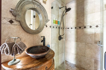 Sleek dual mirrors and bamboo-inspired accents in this polished guest ensuite.