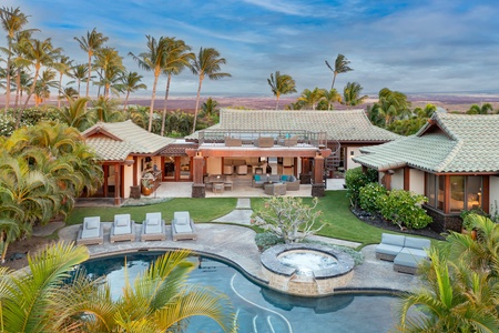 Beautiful circular pool surrounded by lush greenery and comfortable lounge chairs, offering a perfect spot to relax and enjoy the outdoors.