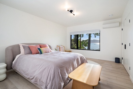 The guest bedroom two has a queen-sized bed and central AC.