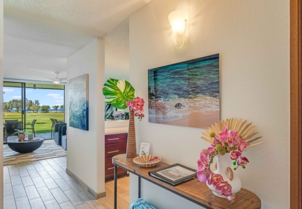 Beautiful Living Room Opens onto Your Private Terrace w/ Golf Course Frontage and Distant Ocean View