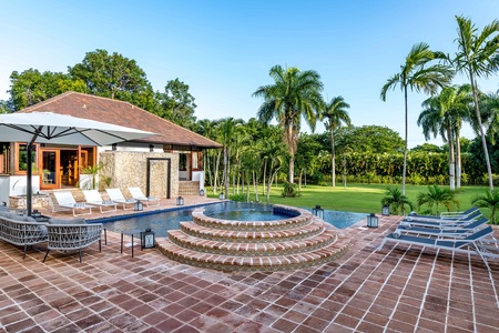 Lounge by the pool and experience the serene beauty of Dominican Republic.