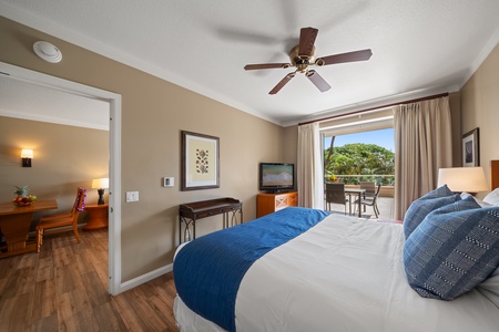 Tuck into soft bedding and mountain views in Honua Kai Konea 230’s inviting primary bedroom.