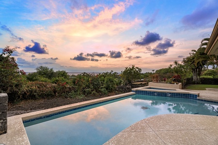 Stunning sunset hues reflected in the tranquil waters of the pool.