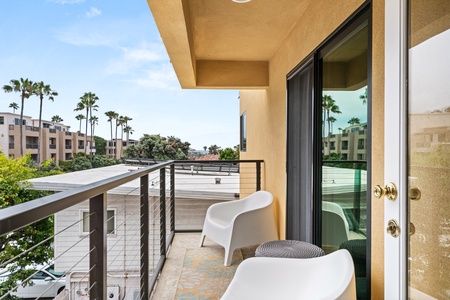 Take in the tropical vibes from your balcony lounge, the perfect spot to unwind.