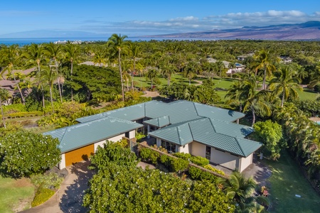 Bird's eye view of the estate, ocean and mountains in the background