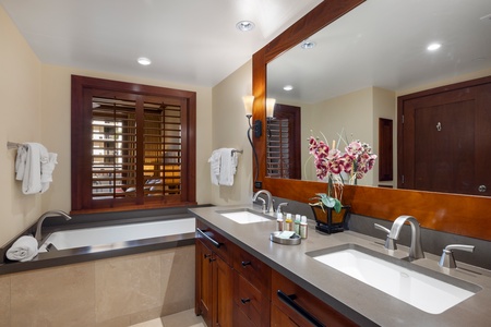 The primary guest bathroom featuring a luxurious soaking tub.