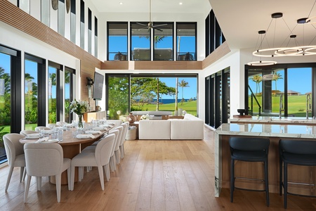 Gather in the soaring great room, where walls of glass invite the beauty of Kaua‘i right inside.