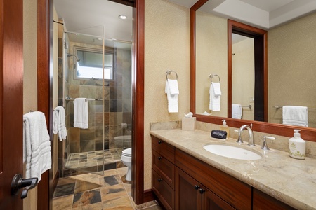 The upper level guest room ensuite bathroom with a separate shower.