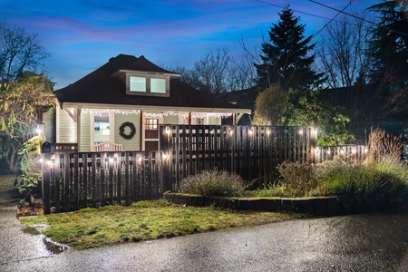 Magical nighttime view of the home, featuring festive lighting and a cozy atmosphere.