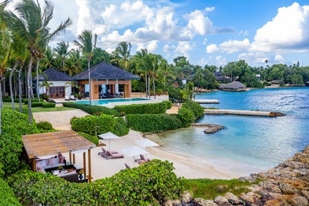 Charming beachfront gazebo, featuring cozy seating and stunning views of the turquoise waters.