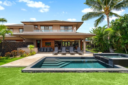 Backyard oasis with pool, spa, and spacious lawn overlooking the fairway.