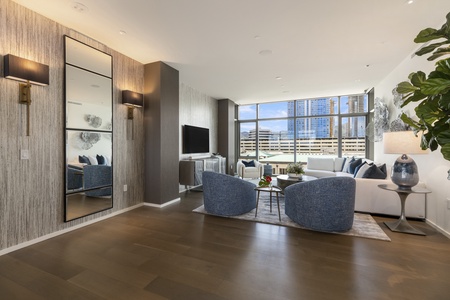 With floor-to-ceiling windows, the living area is drenched in natural light