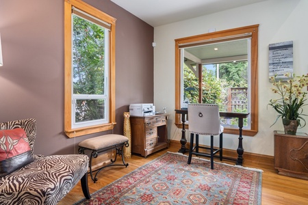 Your personal workspace blends rich wood tones with cozy seating, perfect for productive mornings or quiet evening moments.