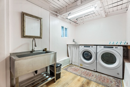 Your own private laundry room features modern washer and dryer with utility sink for effortless care of your vacation wardrobe.