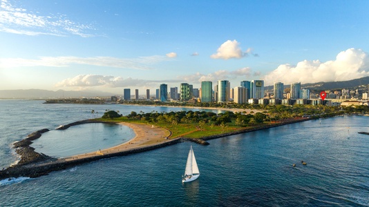 Glistening views of the harbor with sailboats dancing along the water.