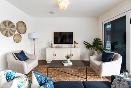 Family room with TV and wall opening to the great outdoors