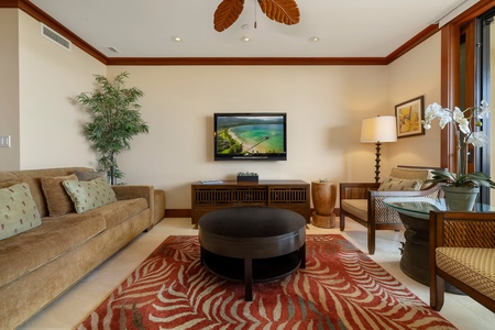 Comfortable lounge anchored by plush sofa and vibrant area rug.
