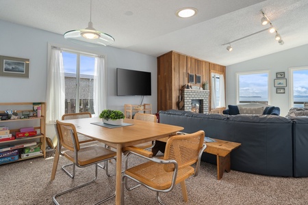 The dining area has table for four, right of the living area.