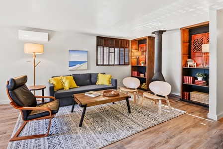 The living room features a real fireplace, creating a cozy atmosphere for relaxing or entertaining.