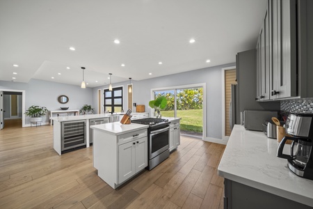 Bright kitchen area with expansive windows and ocean-facing workspace—prepare meals with a view.