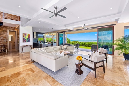 Seamless indoor-outdoor connection in the living area leading to the beach.