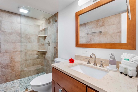 The updated ensuite bathroom features a spacious vanity and tub/shower combination.