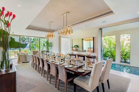 Elegant dining area with seating for eighteen, perfect for memorable gatherings.