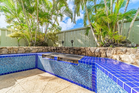 Beautiful bbq in blue stones for guests to use.