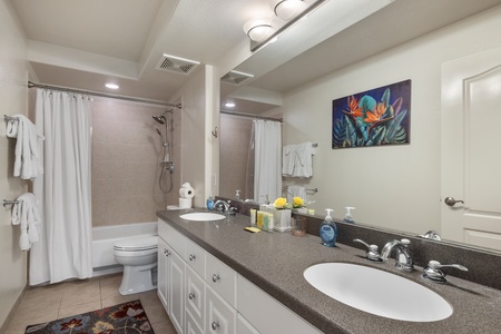 Refresh in your spacious bathroom with dual sinks, granite counters, and a relaxing tub-shower combo—perfect for unwinding after adventures.