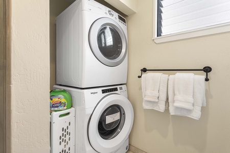 Washer/dryer conveniently at the primary suite bathroom.