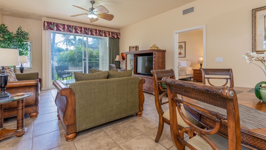 Seamless living in the beautifully furnished living room with a television and a view.