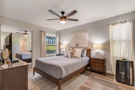 Primary bedroom includes a portable A/C system for added comfort.