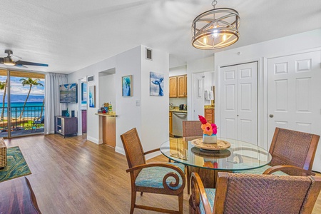 Cozy dining area with seating for four, conveniently located next to the kitchen and living room, ideal for enjoying meals together.