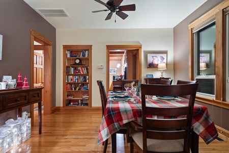 Dining room table with holiday accents, perfect for festive meals and family gatherings.