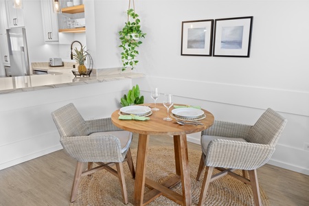 Savor meals and conversations at this charming dining table, beautifully set in a light-filled corner.