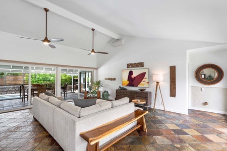 Lounge in the spacious living area with cozy sectional sofas and TV.