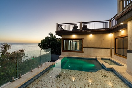 Ocean views and sunshine in private yard with lounge area.