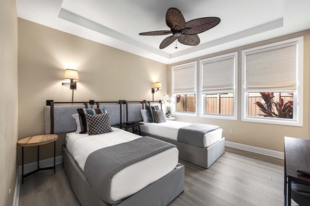 Guest room with twin beds (convertible to a king), A/C, TV, and ensuite bathroom is perfect for kids or friends.