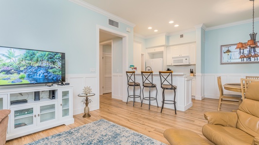 Expansive space includes the kitchen with bar seating, living and dining areas.