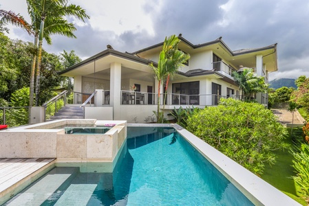 Enjoy your own private pool and spa with stunning views of the lush landscape.