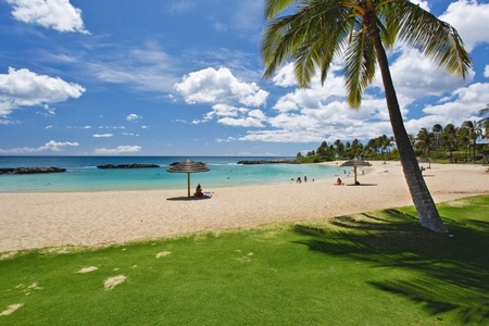 Stroll in the soft sands next to the crystal blue waters of the lagoon.