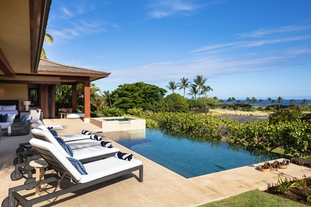 Contemporary design elements delight the senses, like this overflow waterfall from private spa to infinity pool.