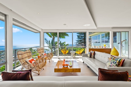 Stylish open living space with modern décor and seamless access to the balcony.