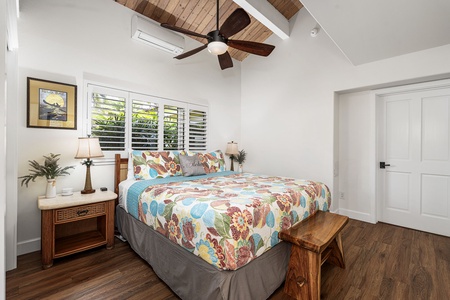 Rest easy in a light-filled bedroom, with vaulted ceilings and a calm, breezy feel.